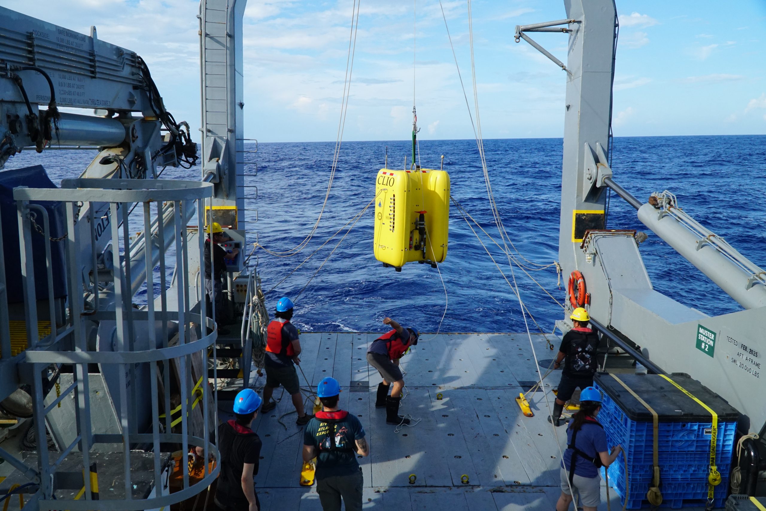The Clio team and crew of the R/V Atlantic Explorer lower the AUV Clio into the water before a dive during C-CoMP cruise AE2520 in September 2025. Photo credit: Fadime Stemmer, WHOI.